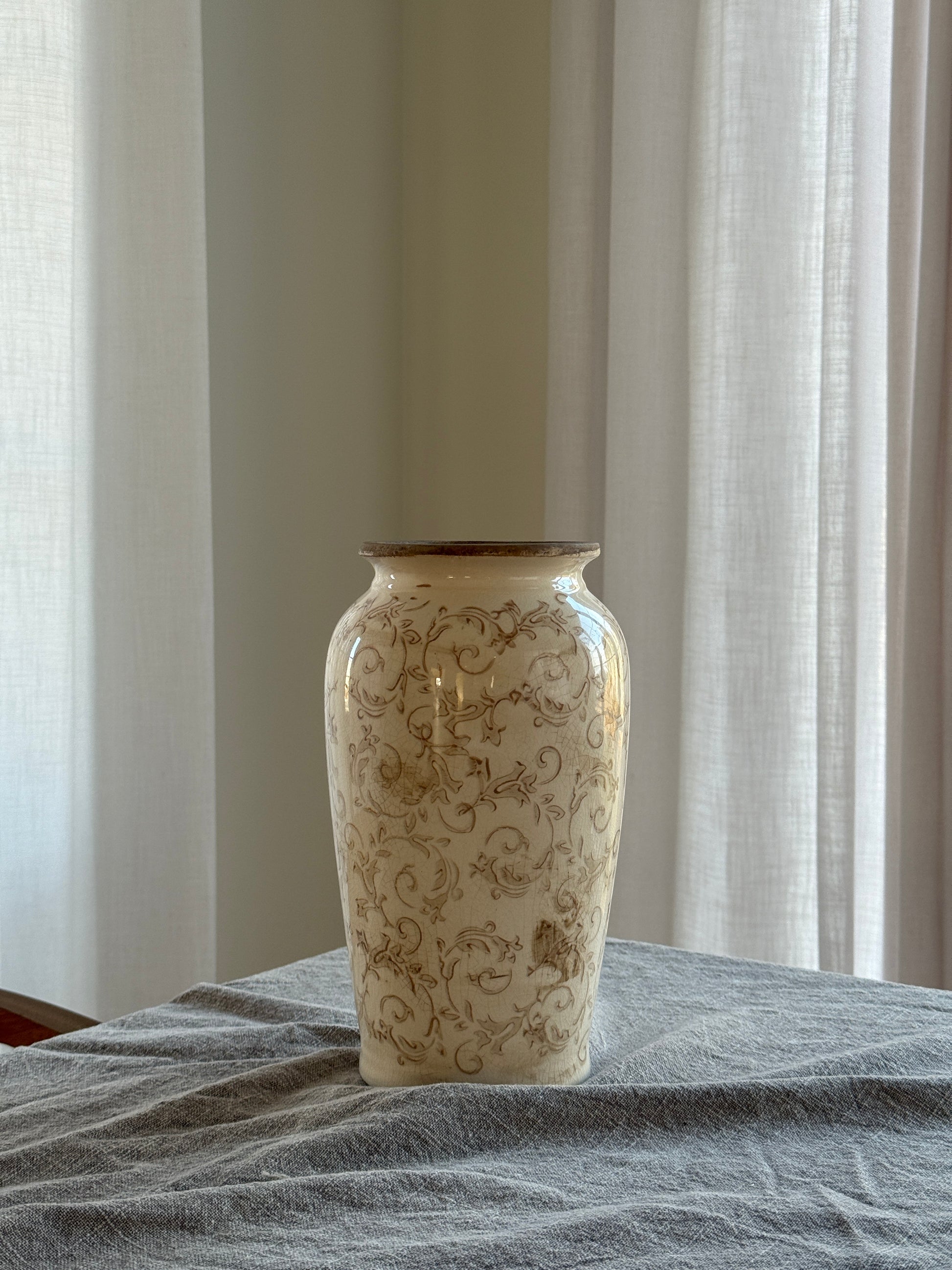 Decorative vase with intricate patterns on a neutral background