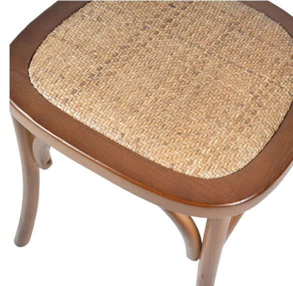 Wooden chair with a woven seat on a white background
