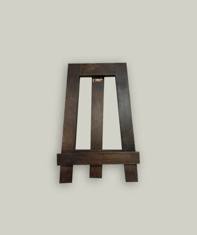 Wooden easel on a light gray background