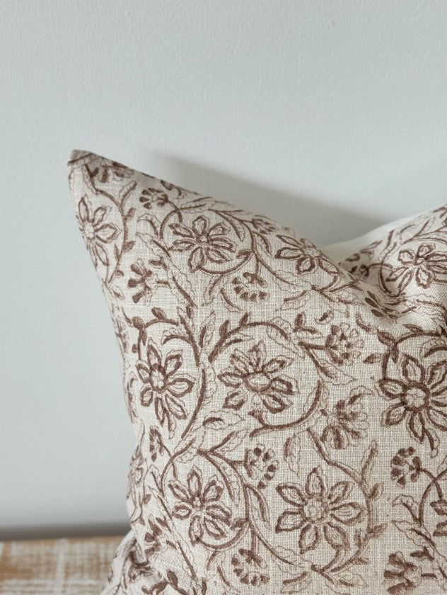 Decorative pillow with floral pattern on a light background