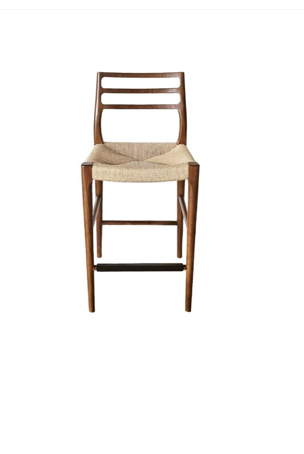 Wooden bar stool with a woven seat on a white background