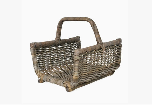 Wicker basket with handle on a white background
