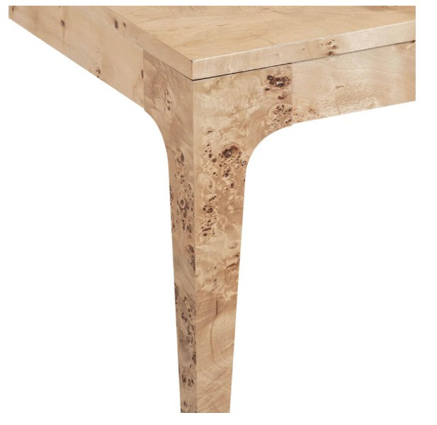 Close-up of a wooden table leg on a white background